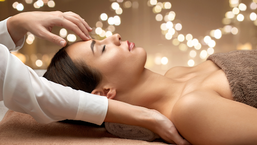 Woman receiving a relaxing spa treatment as a holiday gift experience